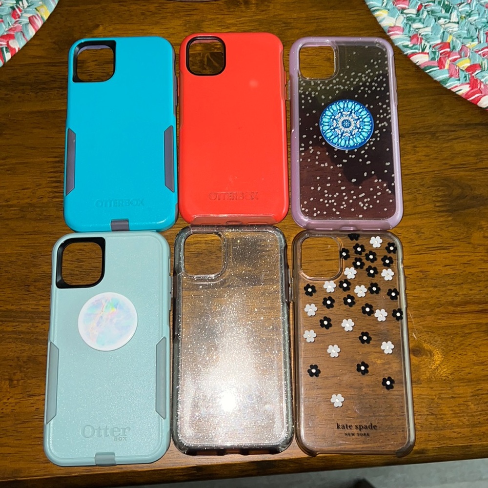 6 iPhone 11 case all Otterbox but 1 is Kate Spade